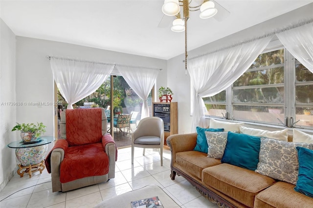 sitting room featuring a ceiling fan and light tile patterned floors