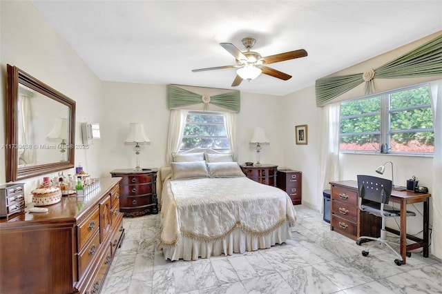 bedroom featuring marble finish floor and ceiling fan