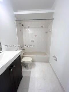 full bathroom with vanity, toilet, and tiled shower / bath combo