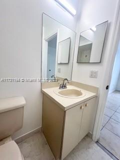 bathroom with vanity and toilet