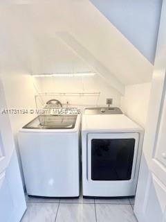 laundry area with separate washer and dryer