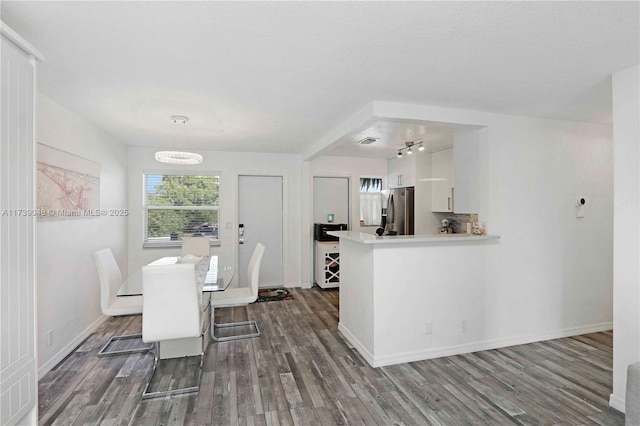 dining room with dark wood-type flooring