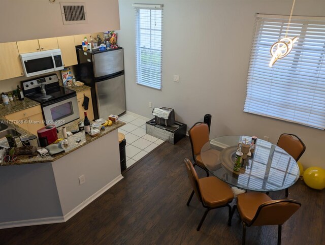 interior space featuring ornamental molding and dark hardwood / wood-style floors