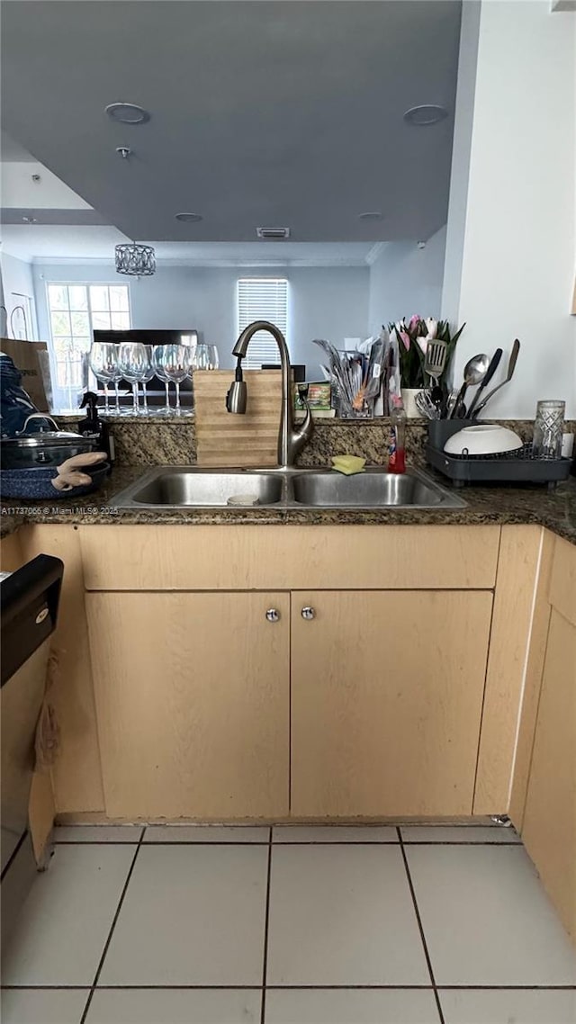 kitchen featuring sink, light tile patterned flooring, and light brown cabinets