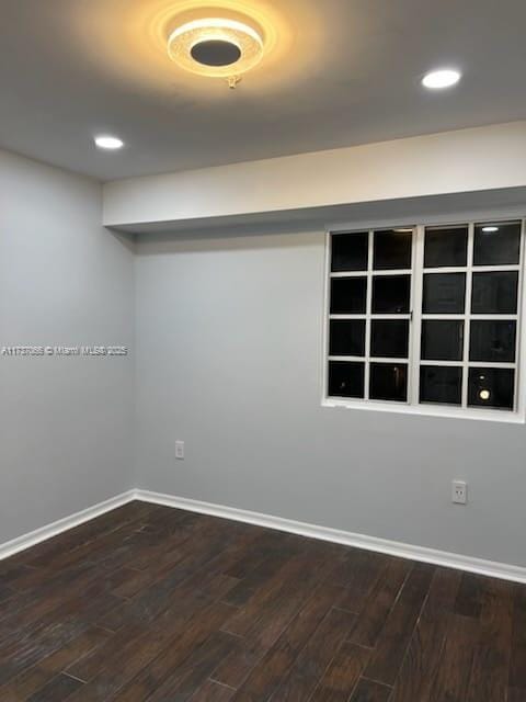 empty room with hardwood / wood-style floors