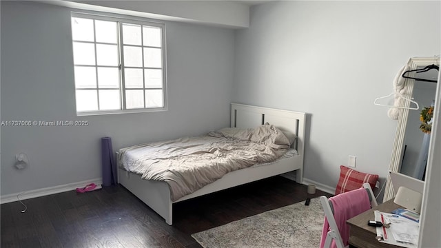 bedroom featuring dark hardwood / wood-style floors