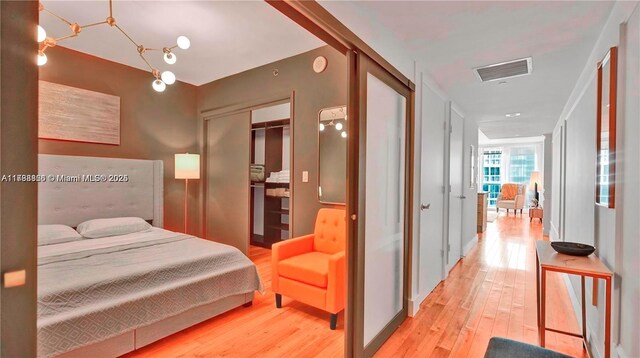 bedroom with a closet and light wood-type flooring