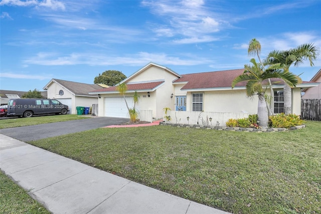 single story home with a garage and a front lawn