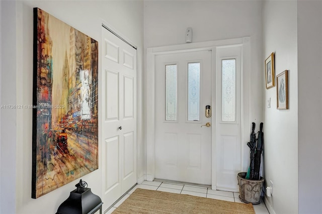 foyer featuring light tile patterned flooring