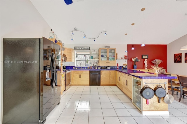 kitchen with decorative light fixtures, light tile patterned floors, light brown cabinets, kitchen peninsula, and black appliances