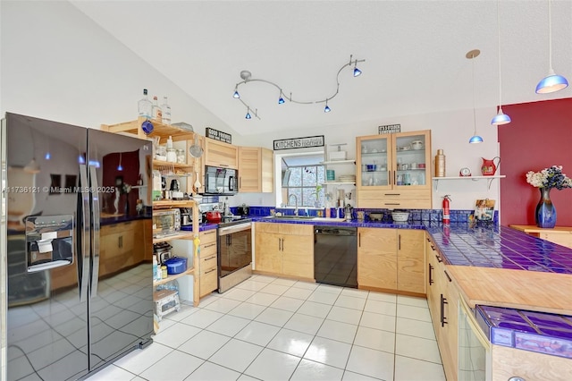 kitchen with light tile patterned flooring, light brown cabinetry, sink, hanging light fixtures, and black appliances