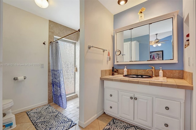 bathroom with a shower with curtain, tile patterned floors, toilet, and vanity