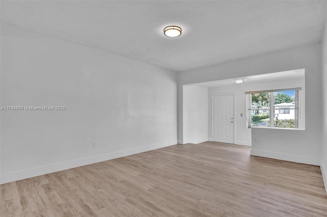 spare room with light wood-type flooring