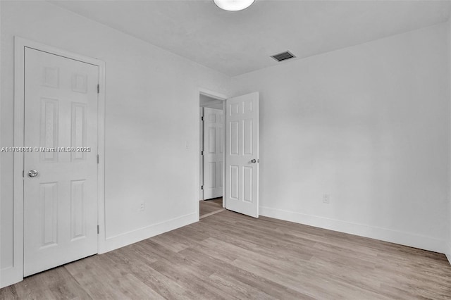 empty room with light wood-type flooring