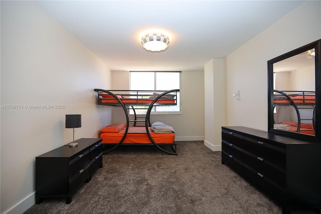 bedroom featuring dark carpet