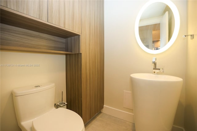 bathroom with tile patterned floors and toilet