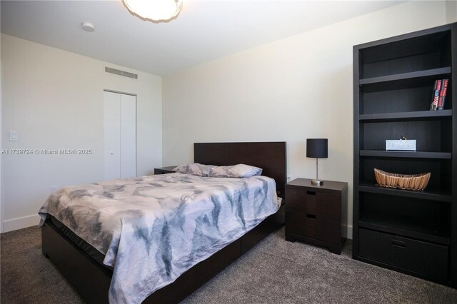 carpeted bedroom featuring a closet