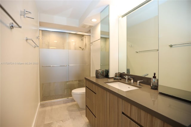 bathroom featuring vanity, tile patterned floors, a shower with door, and toilet