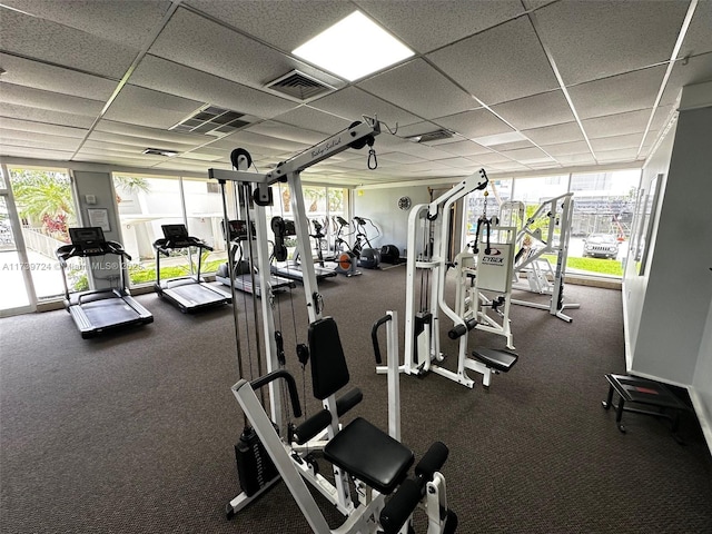 gym featuring a paneled ceiling