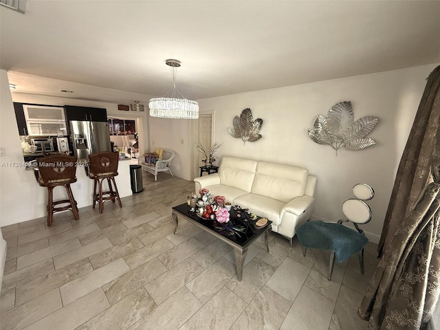 living room featuring an inviting chandelier