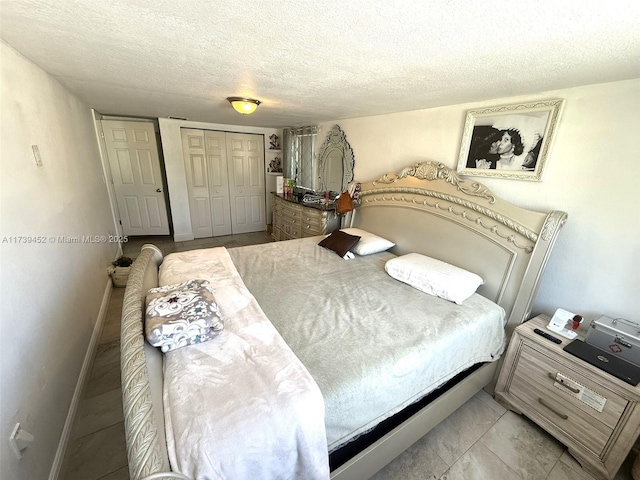 bedroom featuring a closet and a textured ceiling