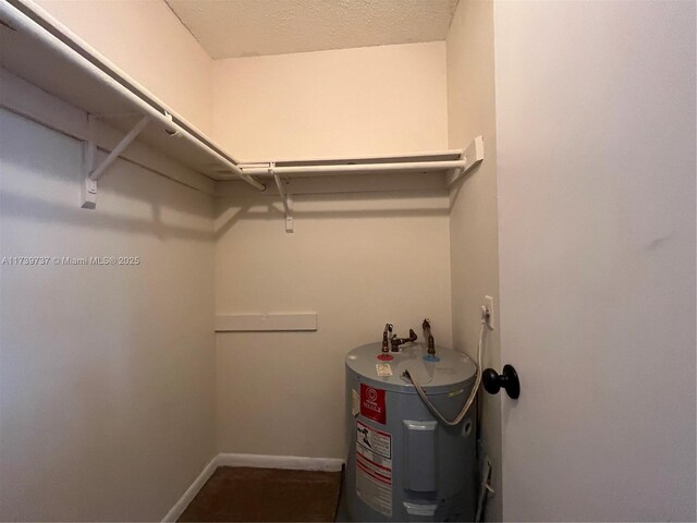 spacious closet featuring water heater