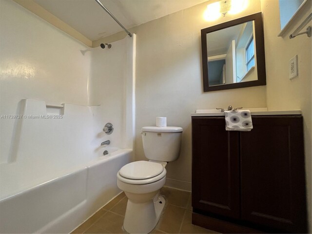 full bathroom featuring vanity, tub / shower combination, tile patterned floors, and toilet