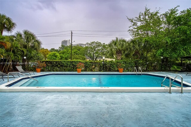 view of swimming pool with a patio