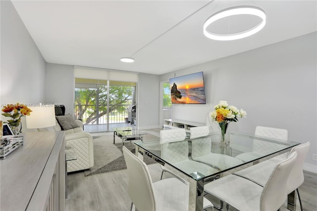 dining area with light wood-type flooring