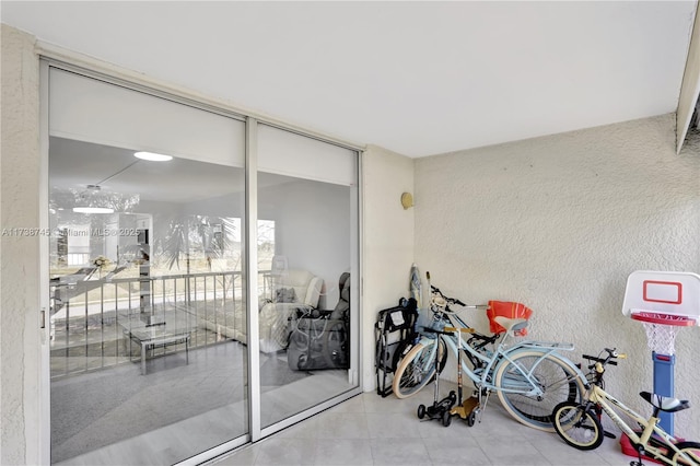 interior space with tile patterned floors and expansive windows