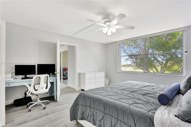 bedroom with ceiling fan and light wood-type flooring