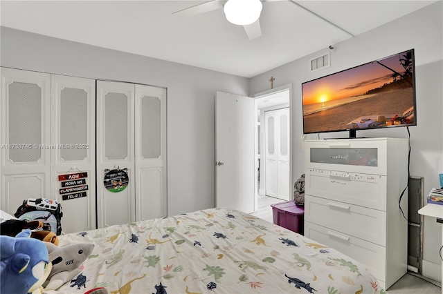 bedroom featuring ceiling fan and a closet