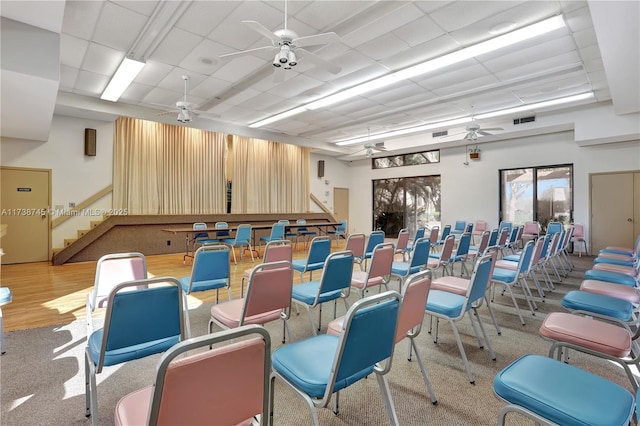 misc room with a paneled ceiling and ceiling fan