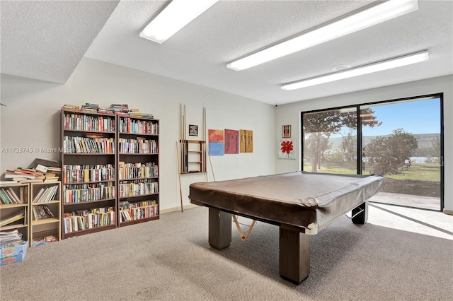 playroom featuring carpet floors, billiards, and a textured ceiling