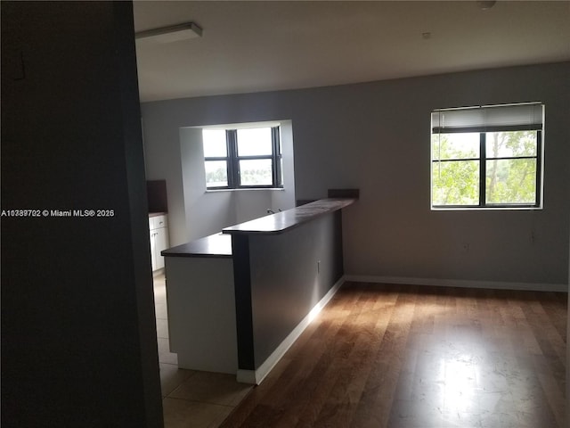 interior space featuring plenty of natural light and light hardwood / wood-style floors