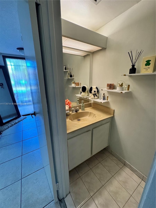 bathroom with vanity and tile patterned flooring