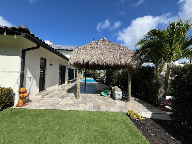 exterior space with a gazebo and a patio