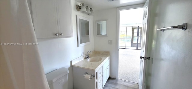 bathroom featuring vanity and toilet