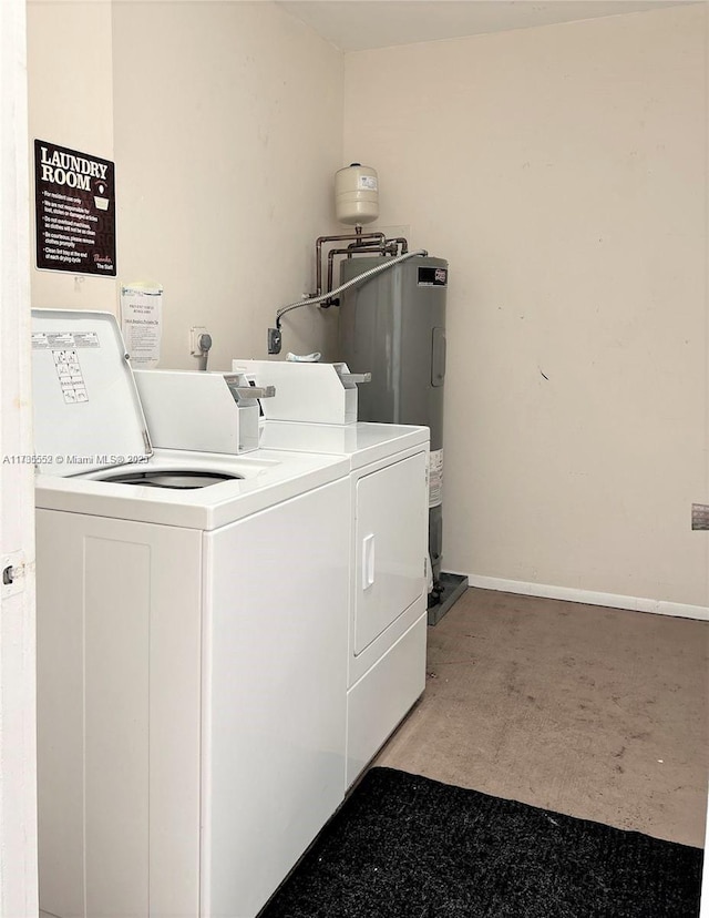 laundry room with washer and clothes dryer and water heater