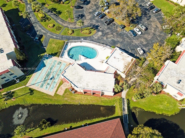 birds eye view of property with a water view