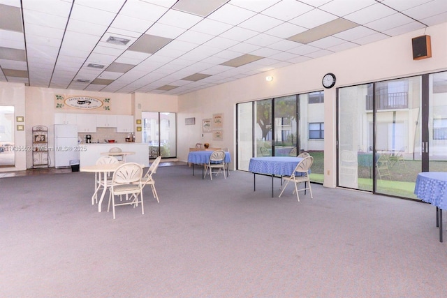 dining room with carpet and plenty of natural light