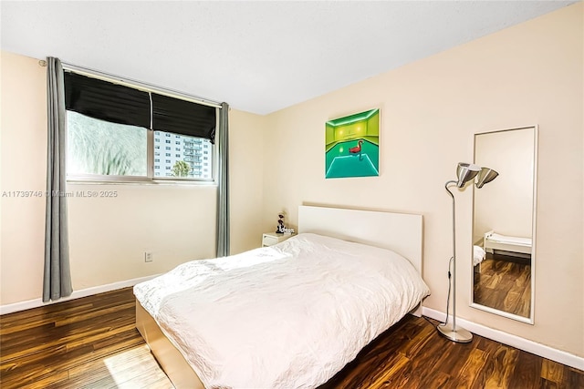 bedroom featuring dark hardwood / wood-style flooring