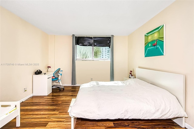 bedroom featuring dark wood-type flooring