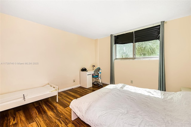 bedroom featuring dark hardwood / wood-style floors