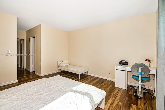 bedroom featuring dark hardwood / wood-style flooring