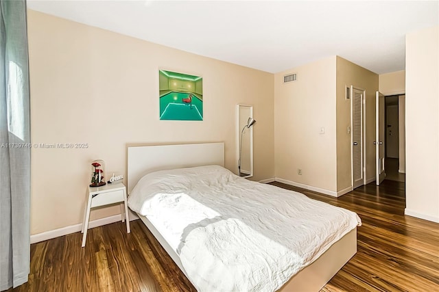 bedroom featuring dark hardwood / wood-style flooring