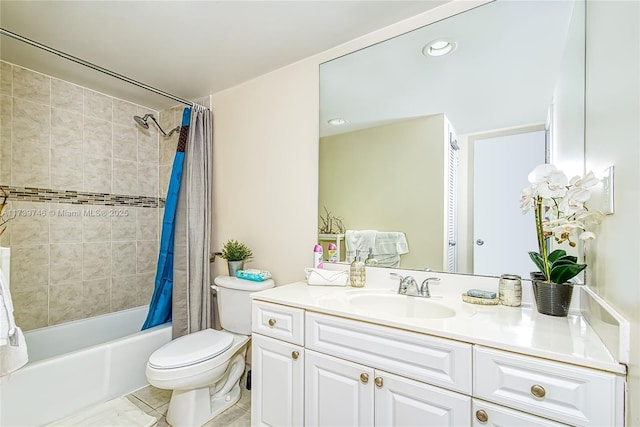 full bathroom with tile patterned flooring, shower / bath combo, vanity, and toilet