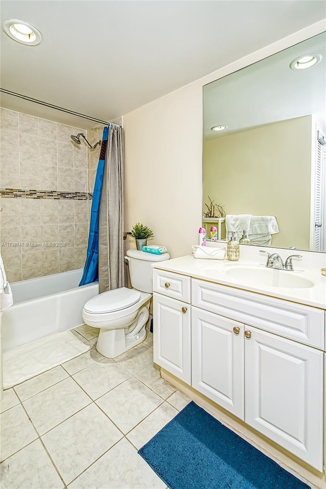 full bathroom featuring tile patterned flooring, vanity, shower / tub combo, and toilet