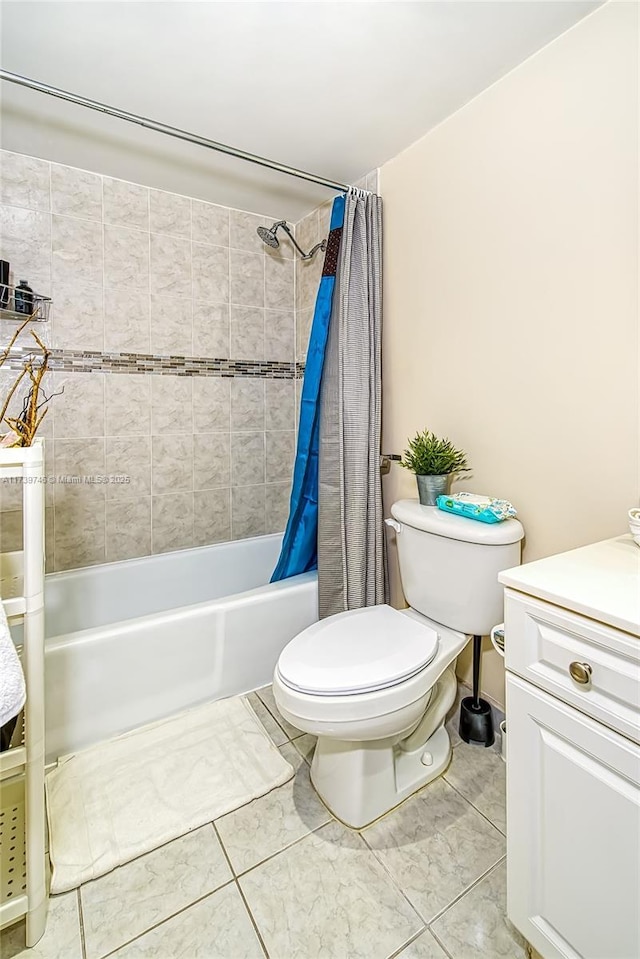 full bathroom featuring shower / tub combo, vanity, tile patterned floors, and toilet