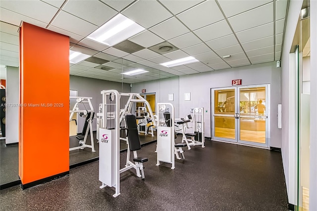 gym featuring a drop ceiling